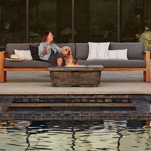 belvedere teak lounging and contempo fire table in dark basalt