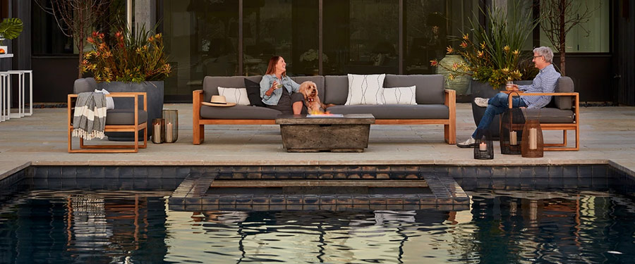 belvedere teak lounging and contempo fire table in dark basalt