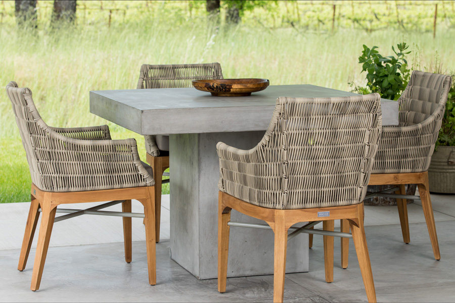 Mason concrete dining table with Madera chairs made from teak and wicker