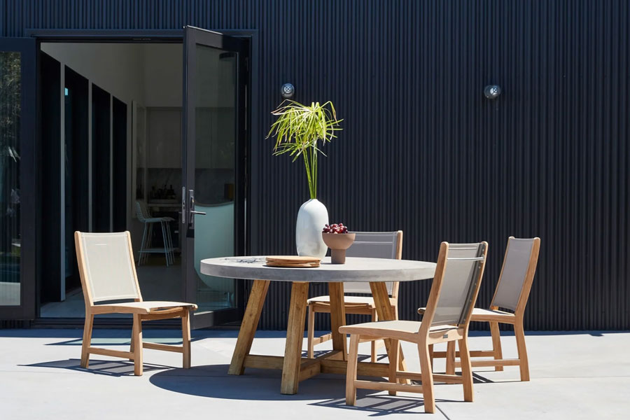al fresco dining set up with concrete outdoor table