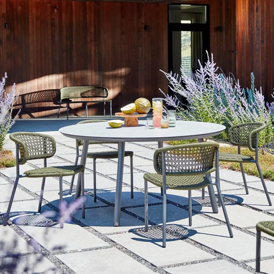 Round Mariposa dining table and chairs for al fresco escape for mobile view