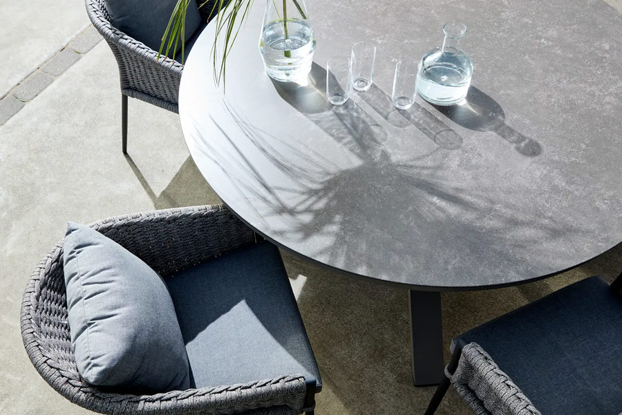 The Portola Dining table in charcoal with ceramic-style glass top paired with Fortuna dining chairs
