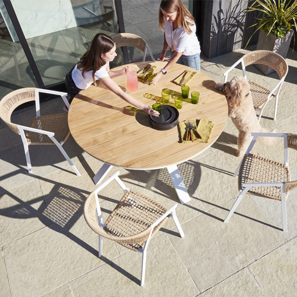 The Portola dining table and chairs, built with aluminum frames, teak and woven rope for mobile