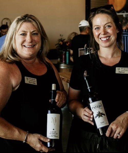Staff at the McGrail Vineyard holding wines