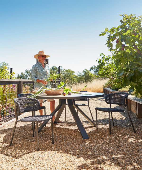 gardening outdoors on a sunny day in outdoor dining area