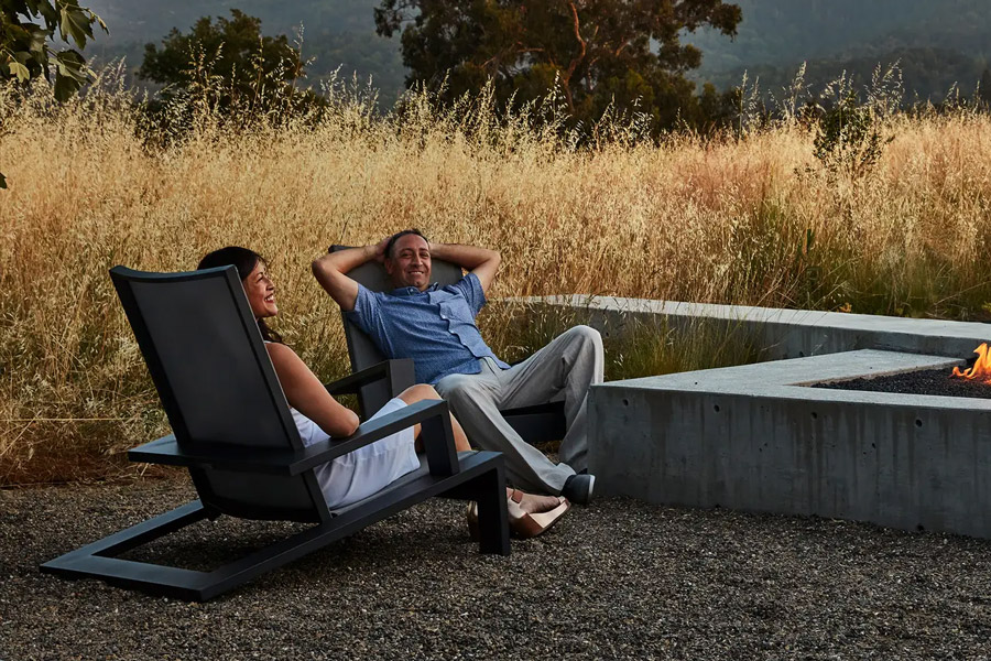 Adirondack outdoor furniture by a fire table