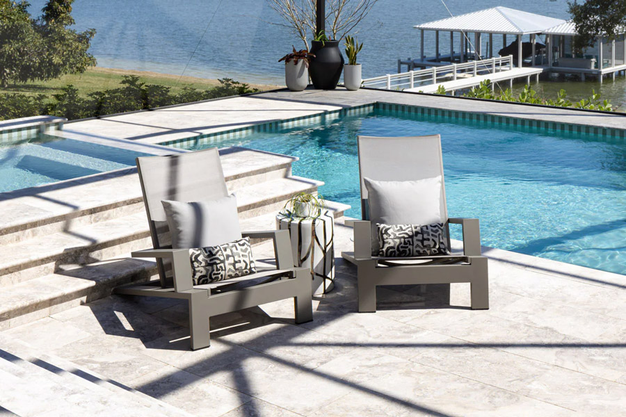 cushionless adirondack chairs with lumbar pillows in Florida sunroom by pool