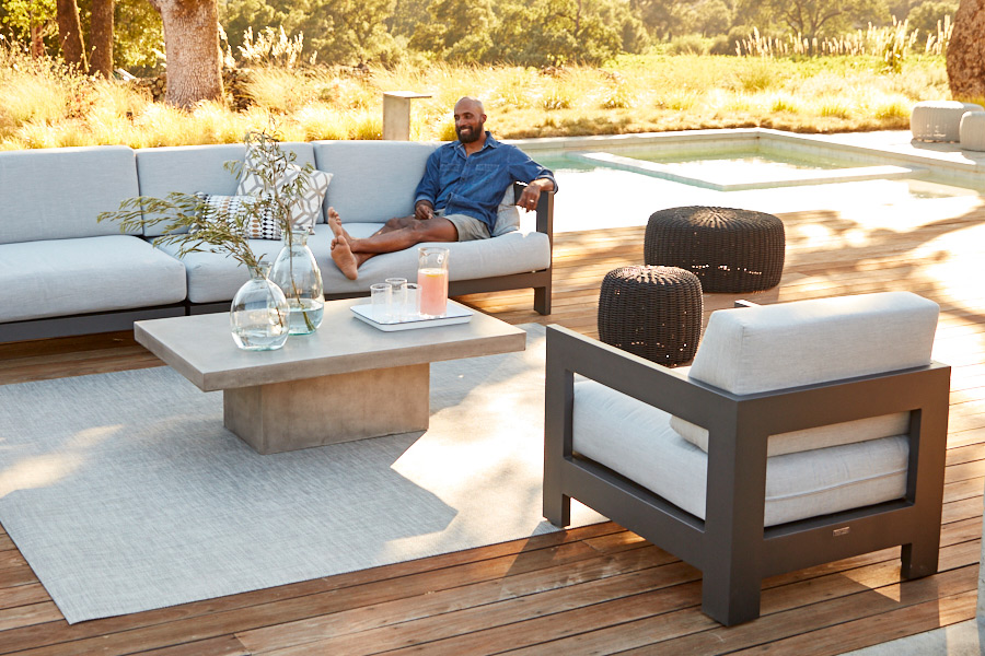 Tiburon seating in charcoal aluminum paired with a Mason coffee table and Chilewich floor mat