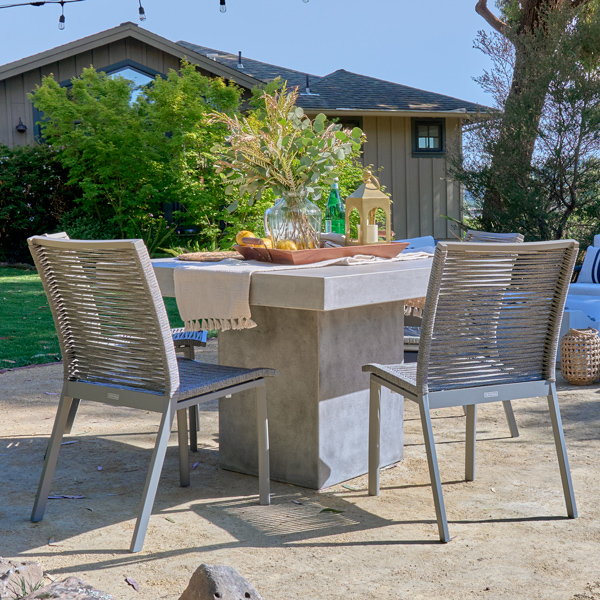 The Mason concrete dining table with Diablo woven rope dining chairs