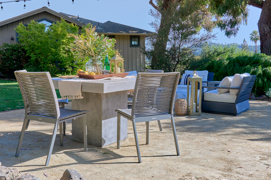 The Mason concrete dining table with Diablo woven rope dining chairs