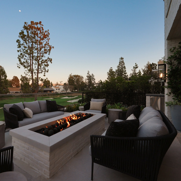 Olema lounge furniture surround a built-in fire pit