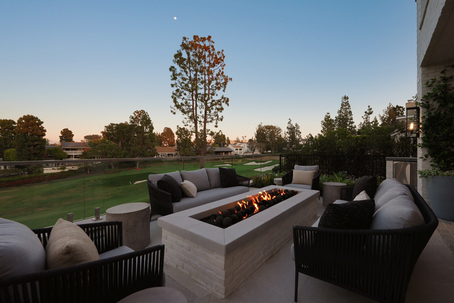 Olema lounge furniture surround a built-in fire pit