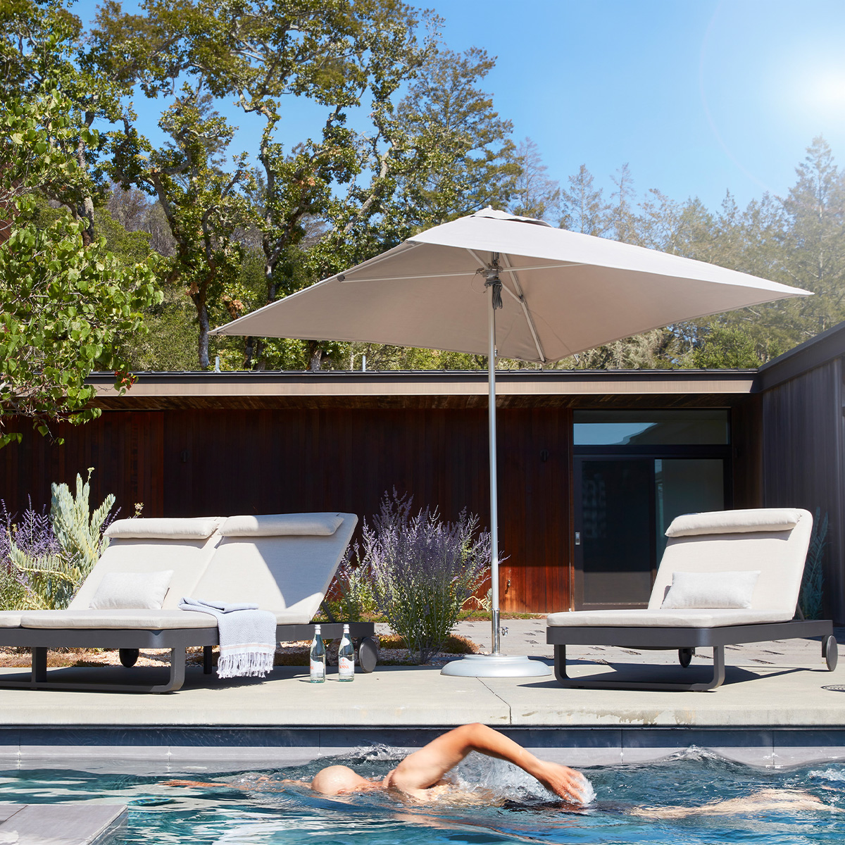 Cambria chaises shaded by TUUCI umbrella